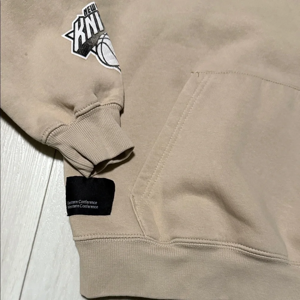 NBA Logo Kid’s Zara Beige Hooded Sweatshirt with pocket and graphics -Size 11-12